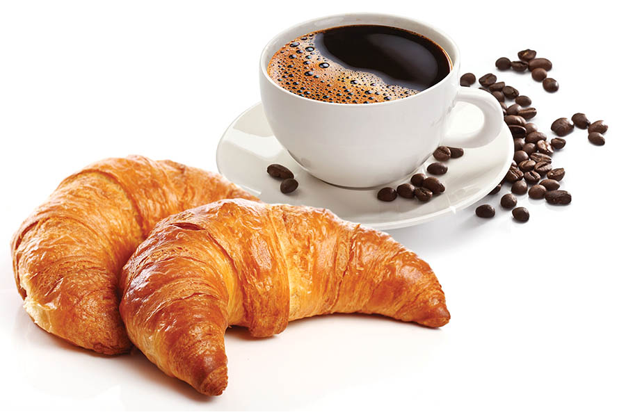 Croissant next to a cup of coffee |Image credit: lafayettetr.com